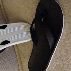 Women's Nike Flip Flops Black with a white sole
